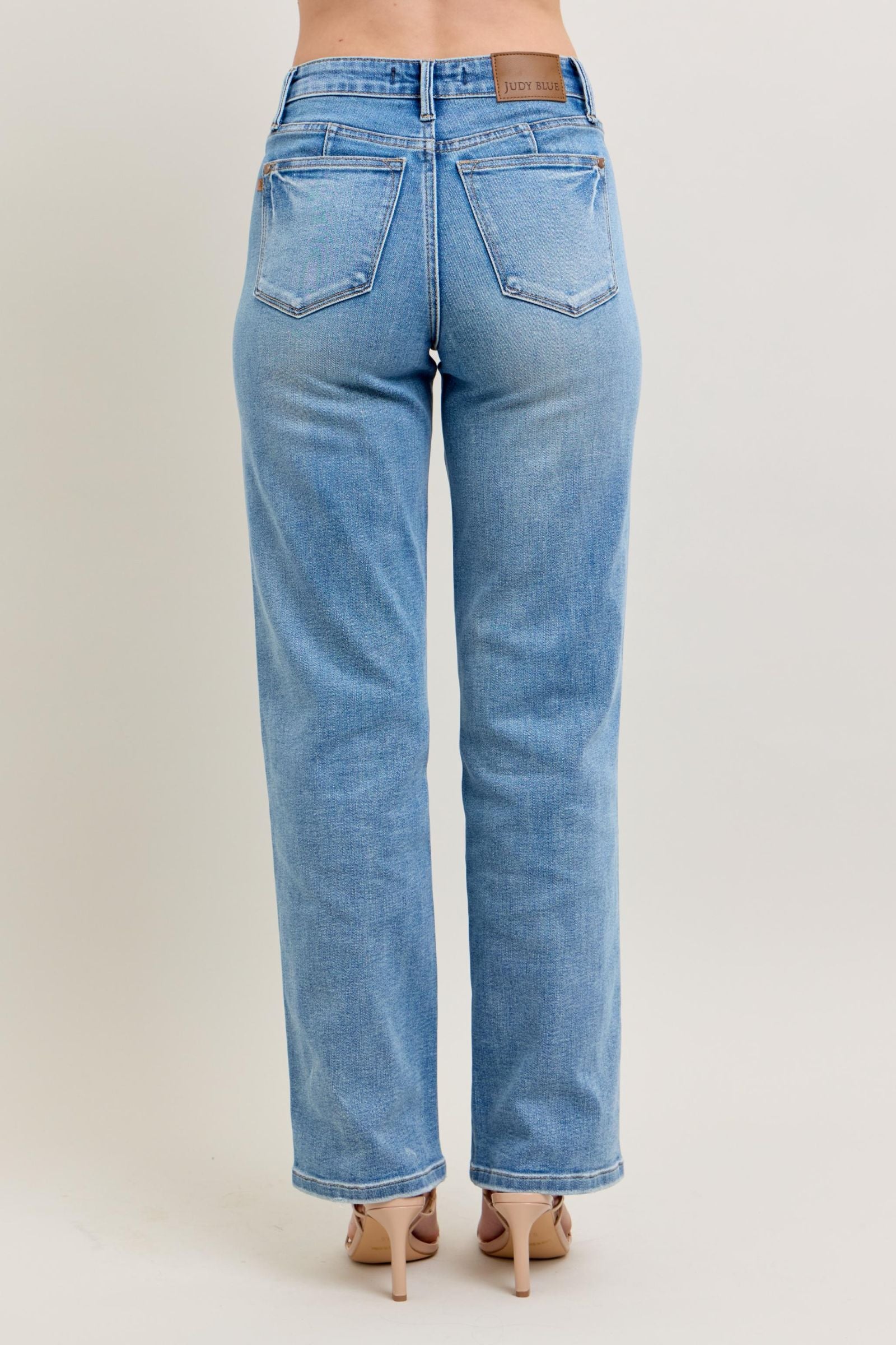Judy Blue Tummy Control Vintage Wash Straight jeans with two back pockets and tan patch. Available in sizes 0-24W.