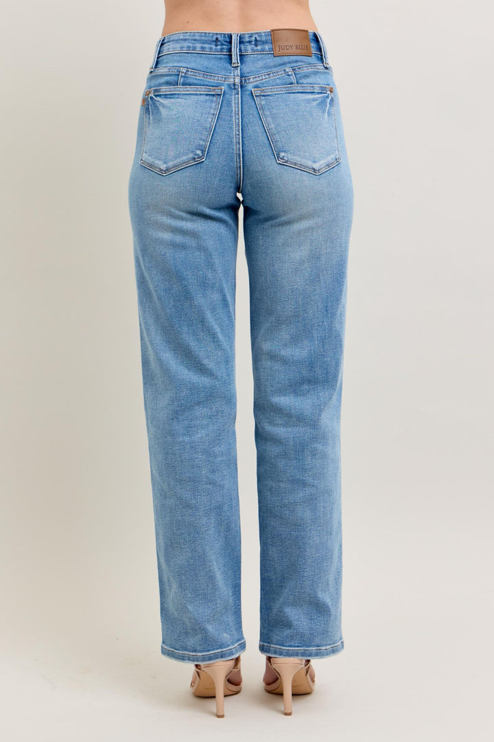 Judy Blue Tummy Control Vintage Wash Straight jeans with two back pockets and tan patch. Available in sizes 0-24W.