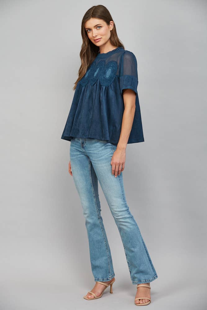 Teal blue short-sleeved top with sheer mesh yoke and lace applique, size S.