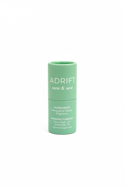 Green cylindrical "ADRIFT sun & sea" Keychain Mini Rollerball Perfume, available in mini size. Ideal for sensitive skin.