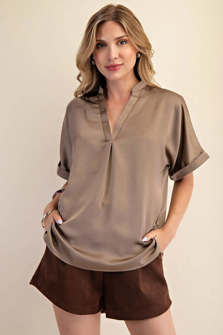 Mocha Signature Satin Top: elegant taupe blouse with short cuff sleeves and a V-neck. Available in sizes XS–XL.