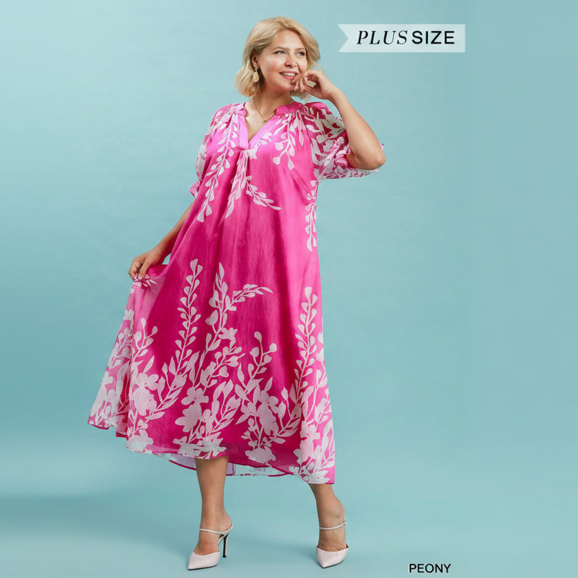 Pink Peony Midi Dress: pink, flowy, floral print, split V-neckline, puff sleeves. Available in sizes XS–XL.