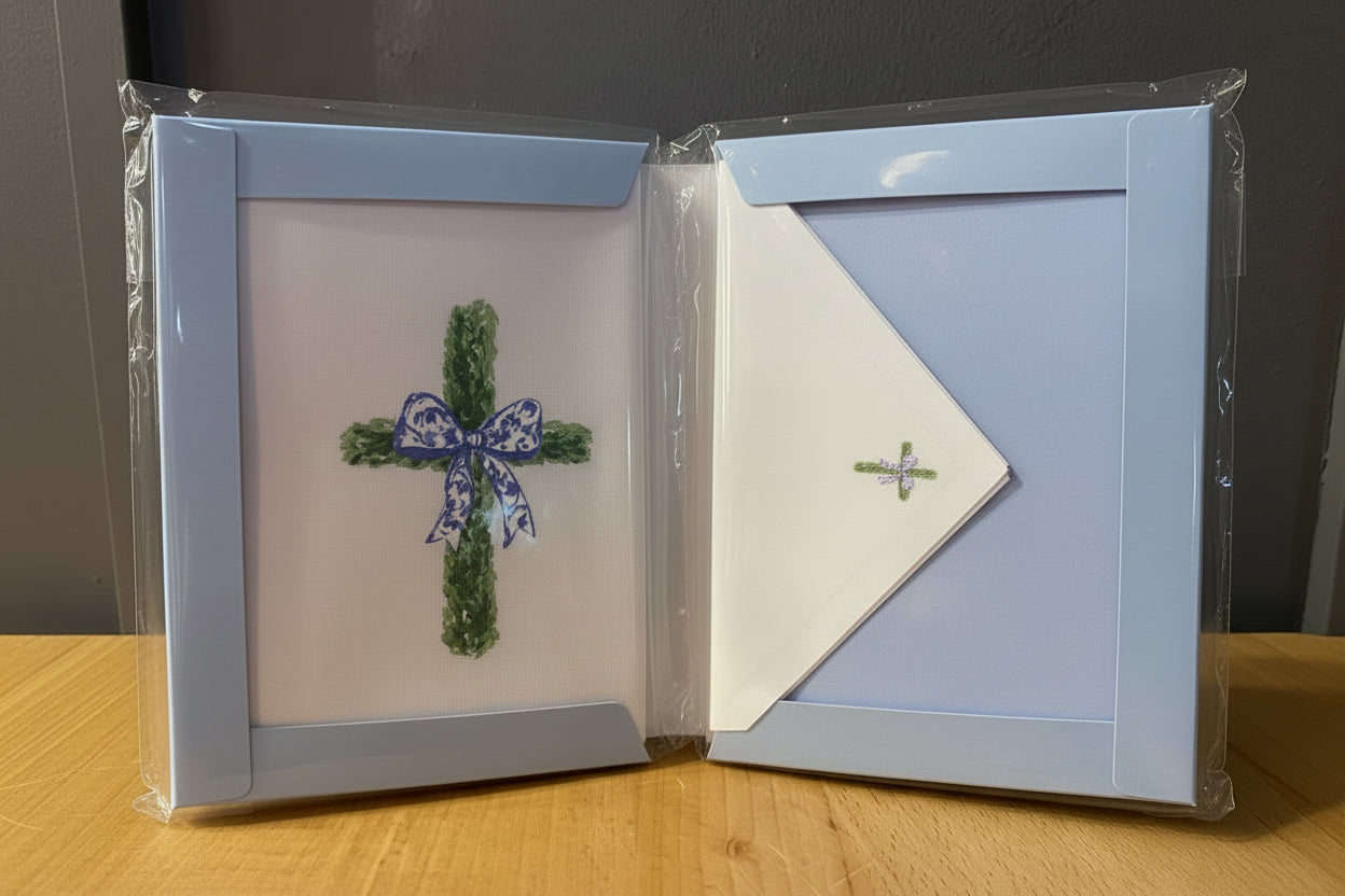 Stationery set with framed artwork and matching envelope, green cross, blue-and-white bow. Available in standard sizes.