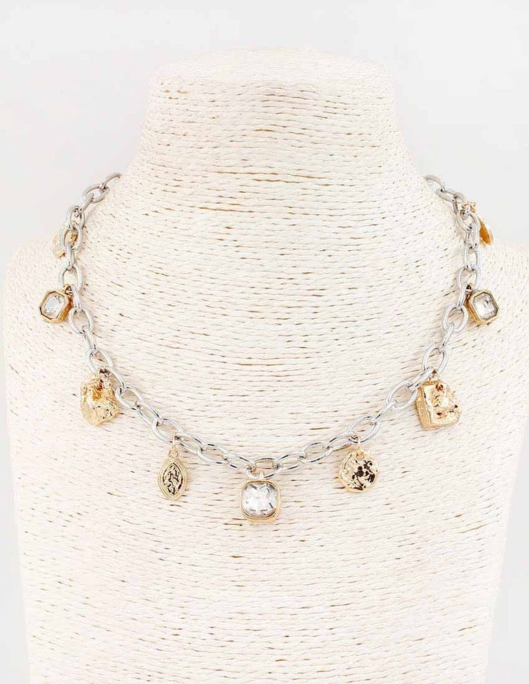 Flynn Gold Silver Necklace with crystal charms and geometric pendants. Available in 16", 18", and 20" lengths.