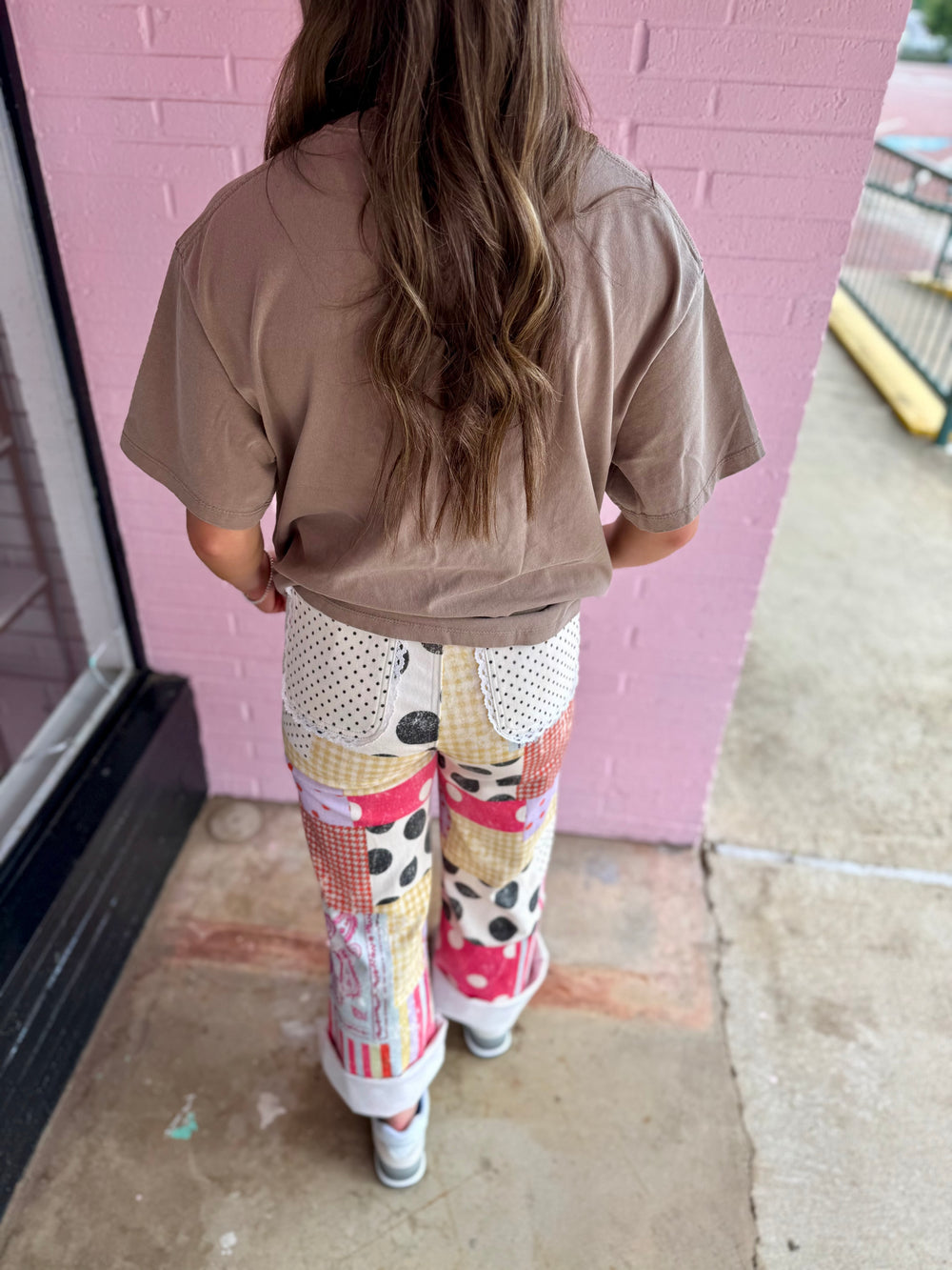 Harper Playful Patch Denim Pants with colorful patterns. Available in sizes XS-XL.