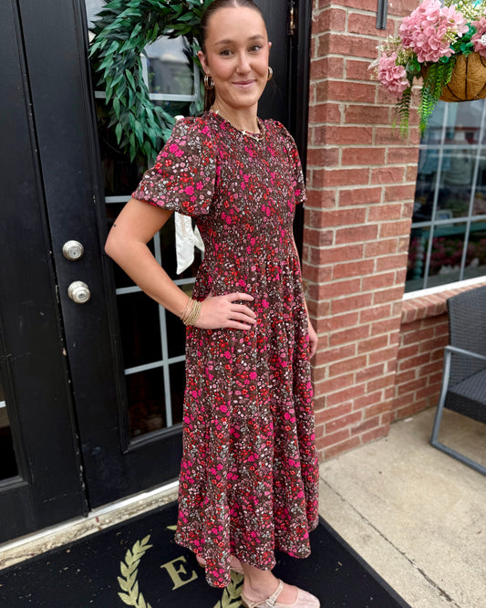 Lucille Granada Glen Cocoa Dress: dark floral print with pink and red flowers, smocked bodice. Available in sizes XS-XL.