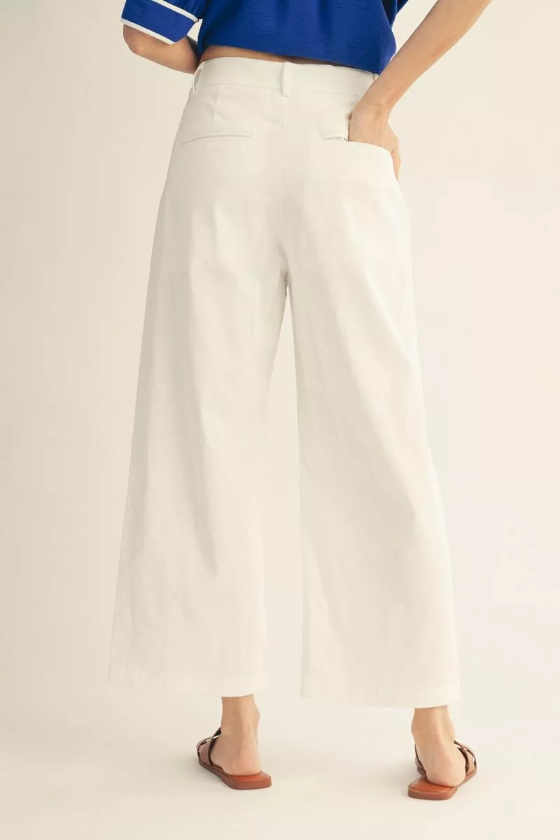 Scalloped Pocket Off White Pants, available in sizes XS-XL. Features scalloped pockets and straight-leg fit.