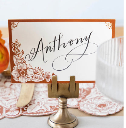 Place Card Holders display a card with "Anthony" in script and floral accents. Available sizes: small, medium, large.