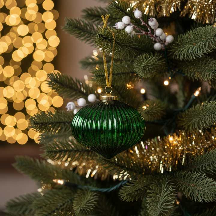 Mancini 4” ribbed green glass ornament.