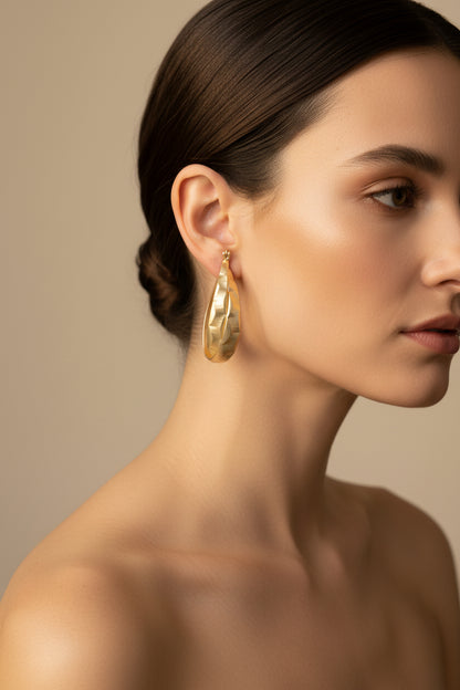 Hoop Earrings in a polished finish, available in small, medium, and large sizes.