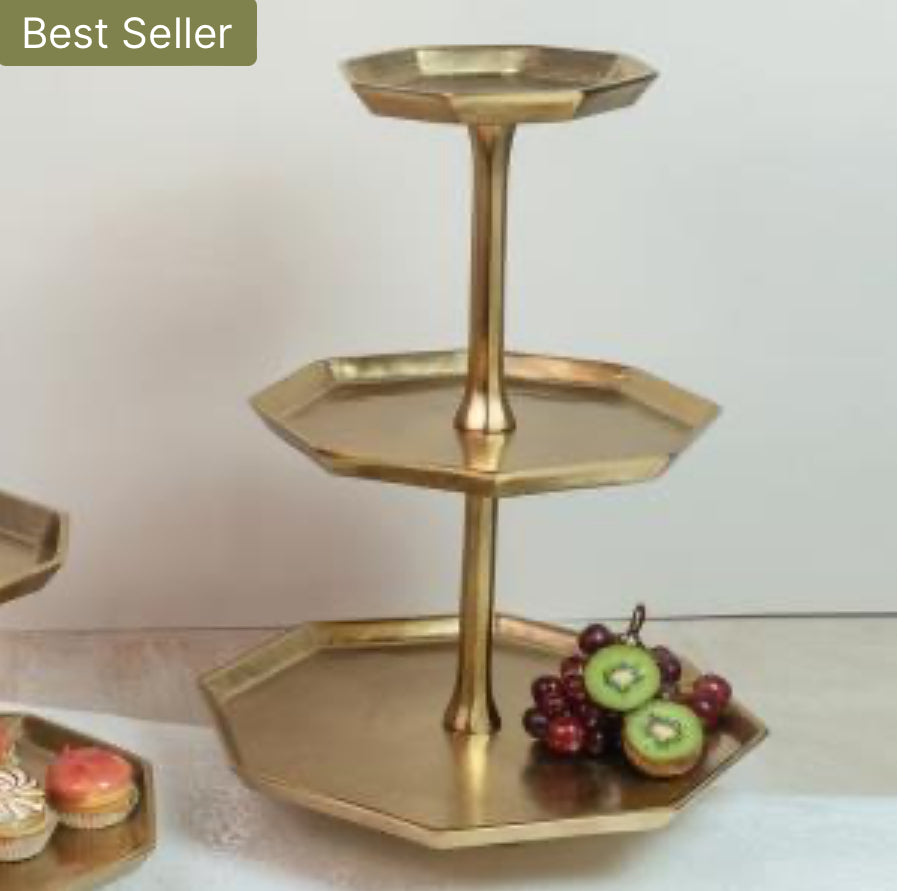 The Gilded 3 Tier Octagon Stand features a luxurious gold finish and elegantly holds various desserts. Sizes available: Small, Medium, Large.