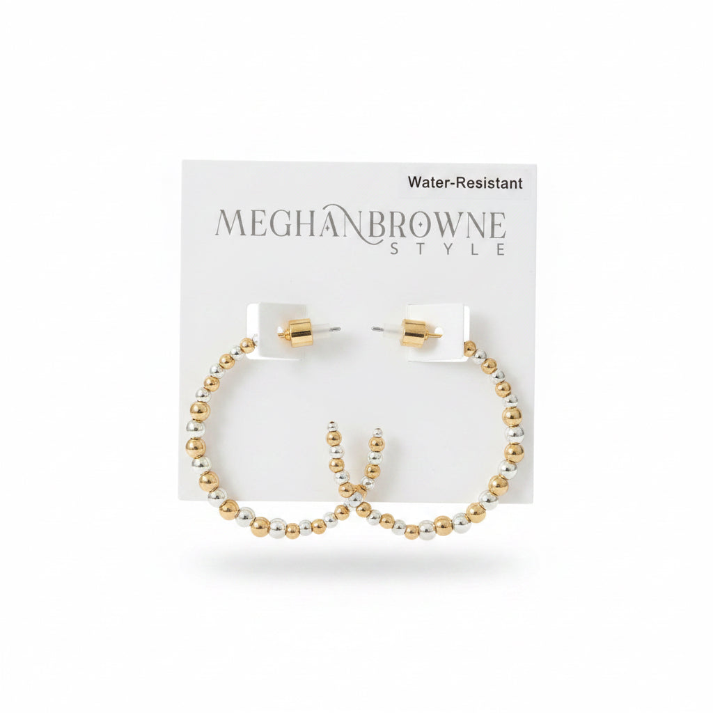 The Spirit Gold Silver Earrings are gold and silver beaded hoops, water-resistant, available in multiple sizes.