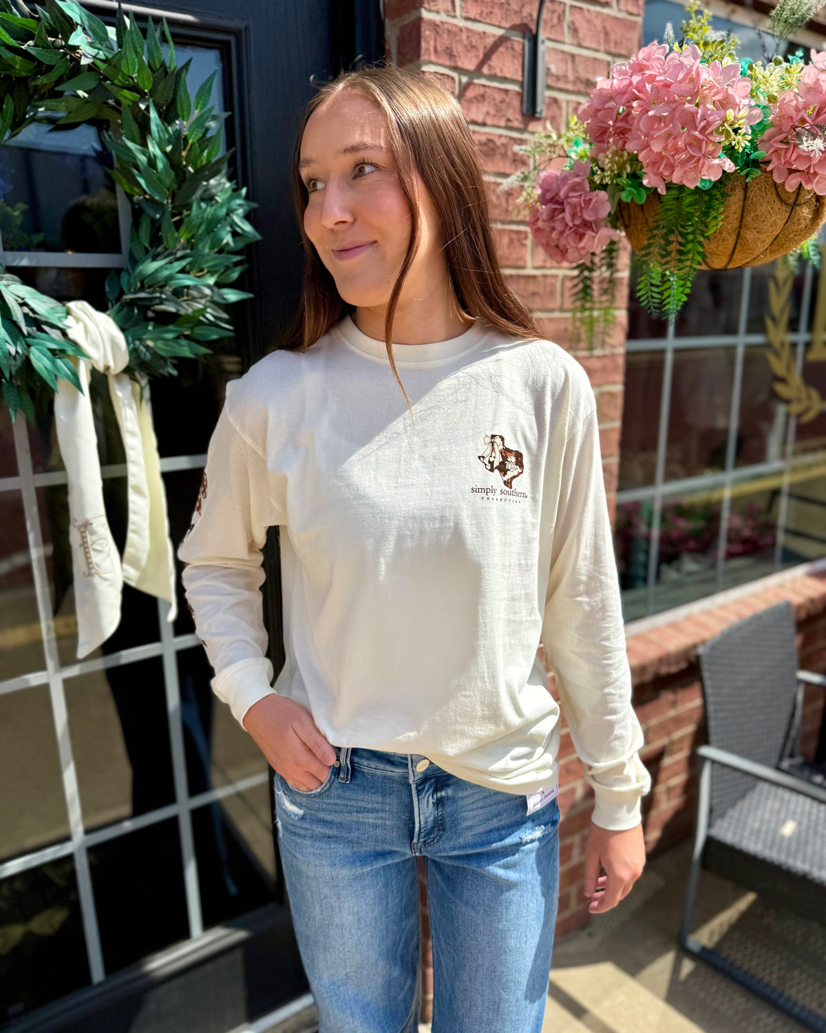 Cream Texas Animal Print Long Sleeve shirt shown; available in sizes S-XL.