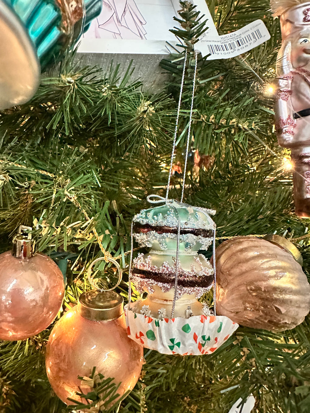 Glass Macaron Ornament, stack of three pastel macarons in a paper liner.