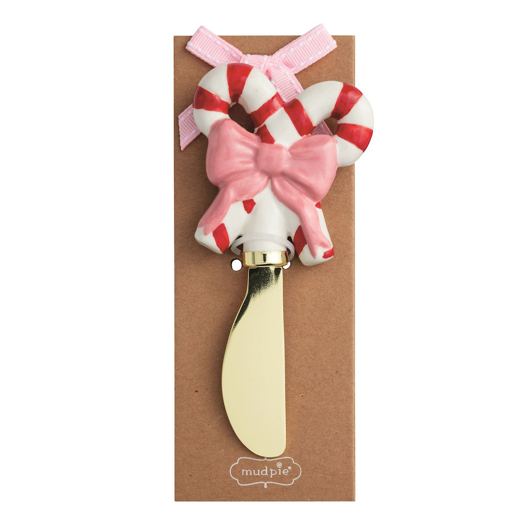 Christmas Whimsy Spreader with candy cane handle, pink bow, and gold-toned metal blade.