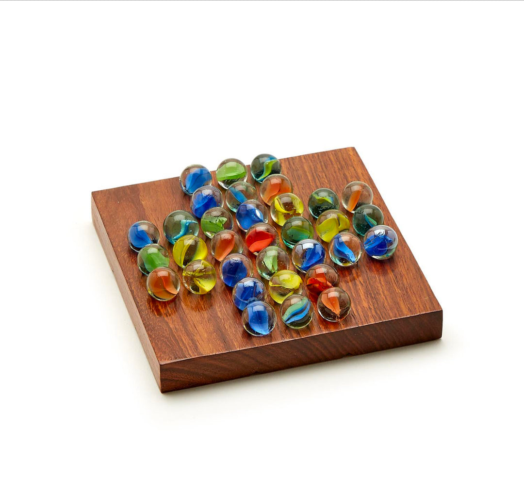 The 2 in 1 Game Set features an acacia wood box with 33 colorful glass marbles in a cross pattern for Solitaire. Sizes vary.