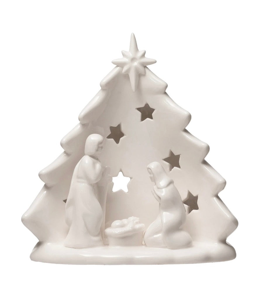 White stoneware Nativity Tree candle holder with cutout star pattern and Mary, Joseph, and infant Jesus. Available in multiple sizes.