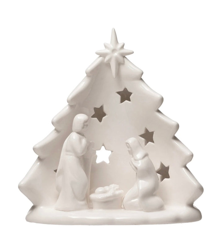 White stoneware Nativity Tree candle holder with cutout star pattern and Mary, Joseph, and infant Jesus. Available in multiple sizes.