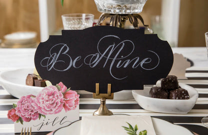 Black "Be Mine" sign with white script; available in small and medium sizes.