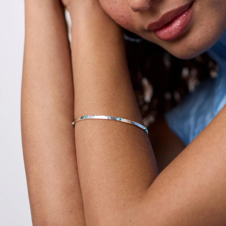 Crescent Stone Bangle: pure silver plate, reconstituted turquoise stones. Available in S, M, L sizes.