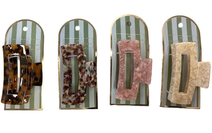 Set of four rectangle claw clips in tortoiseshell, brown, pink, and beige patterns. Available in small and medium sizes.