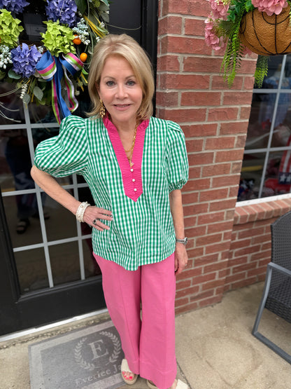 Green and white gingham puff sleeve cotton blouse with pink trim, ruffled collar. Available in sizes XS-XL.