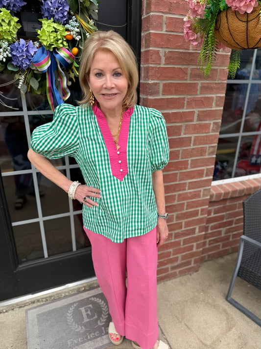 Green and white gingham puff sleeve cotton blouse with pink trim, ruffled collar. Available in sizes XS-XL.