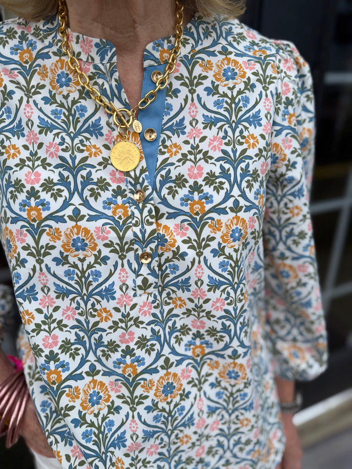Riley Ashdown Abbey Top: balloon sleeves, blue/orange/pink floral print, gold button accents. Available in XS-XL.