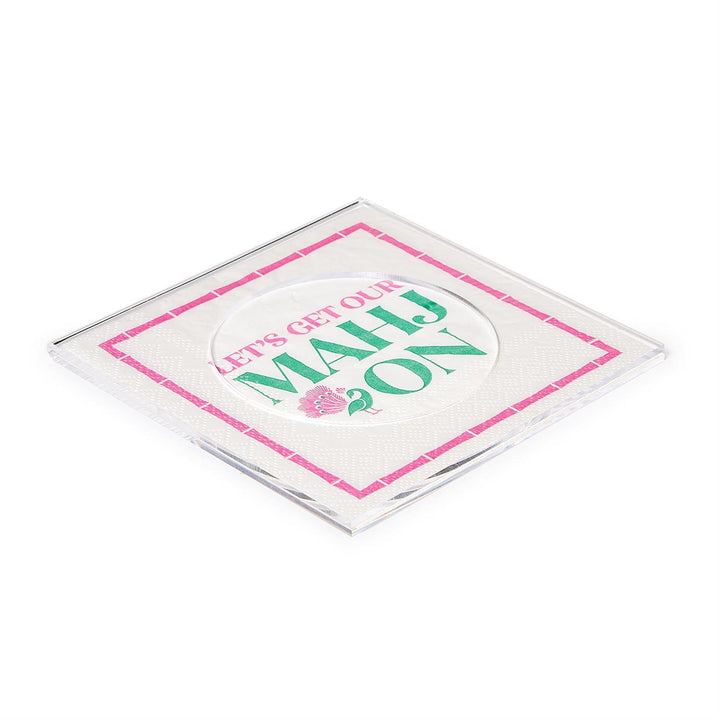 Square clear customizable acrylic coasters with a printed “Let’s get our Mahj on” insert in green and pink lettering.