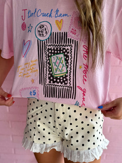 Pink Mahjong Collage Tee with colorful doodles and dice motif. Available in sizes XS-XL.