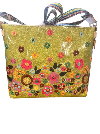 Bright yellow glittery crossbody with colorful flower accents, multicolored strap; available in small and medium sizes.