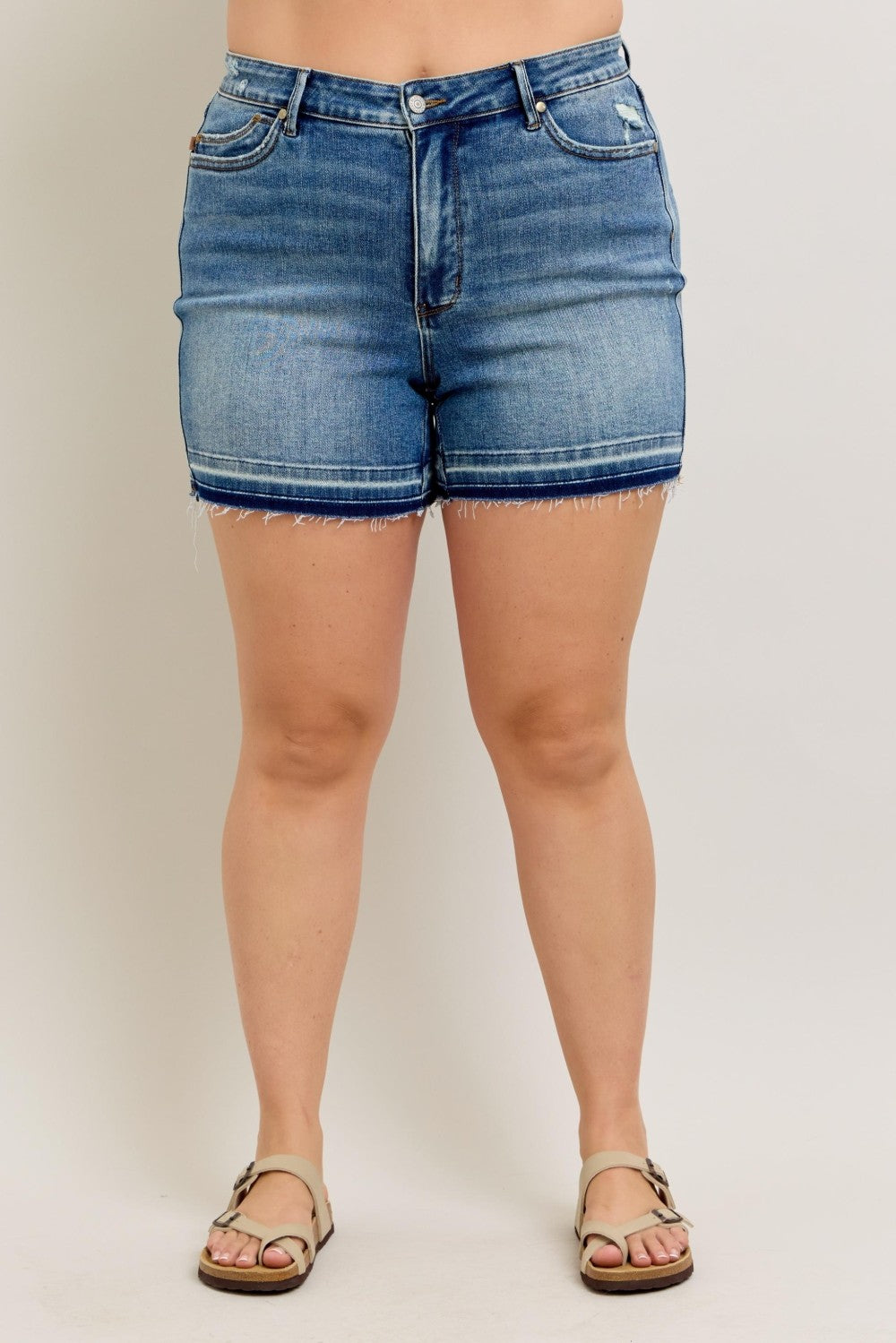 Judy Blue MR Tummy Control Vintage Wash Shorts with frayed hem, faded stripe above hem. Sizes: S-XL.