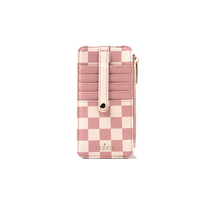 Kedzie Essentials Only Zippered Wallet in Amalfi design, pink and cream checkered vegan leather, features multiple card slots, strap, zippered pocket, and gold “KEDZIE” branding. Available in one size.