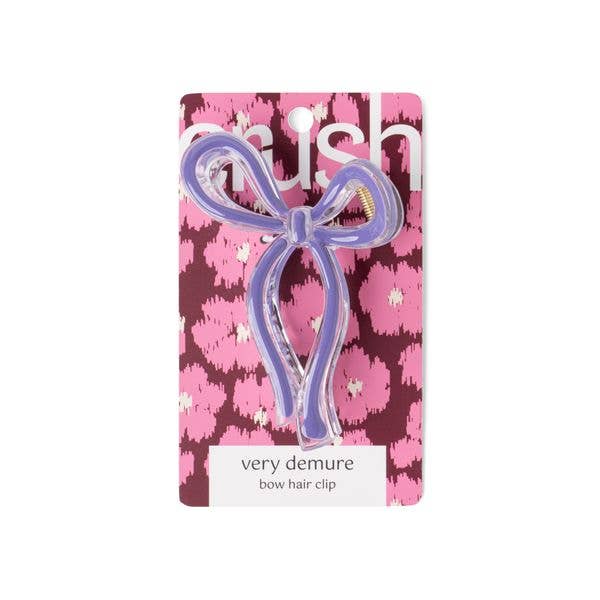 Lavender bow hair clip on pink-purple card. Available in small and large sizes.