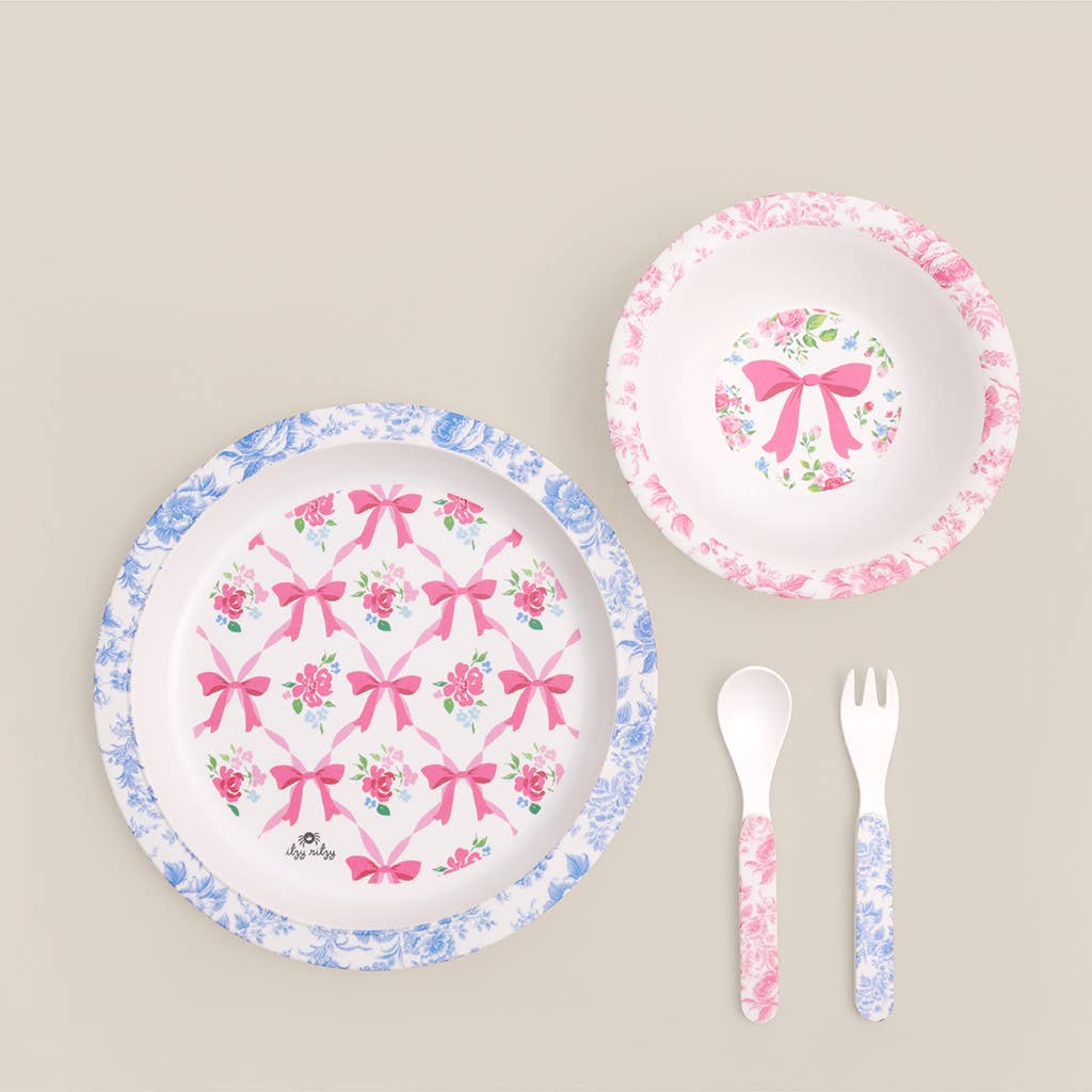 Itzy Bistro™ 4-Piece kids’ dining set: plate, bowl, spoon, fork with bows and floral patterns. BPA-free. Sizes: toddler only.