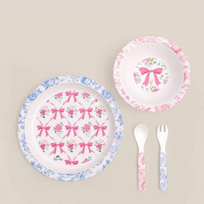 Itzy Bistro™ 4-Piece kids’ dining set: plate, bowl, spoon, fork with bows and floral patterns. BPA-free. Sizes: toddler only.