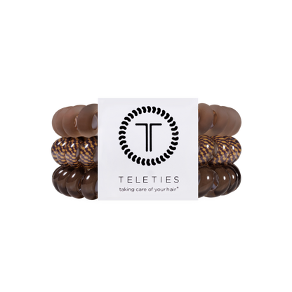 Set of five large Morning Brew Hair Ties in brown and patterned colors, with a white label showing the TELETIES logo and tagline, available in large size. No-crease design for all-day hold.