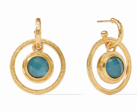 These Astor Statement Hoop & Charm Earrings feature a textured finish with a central teal stone. The stone is set in a smaller dangling hoop. The earrings are crafted from 24K gold plate. Available in one size.