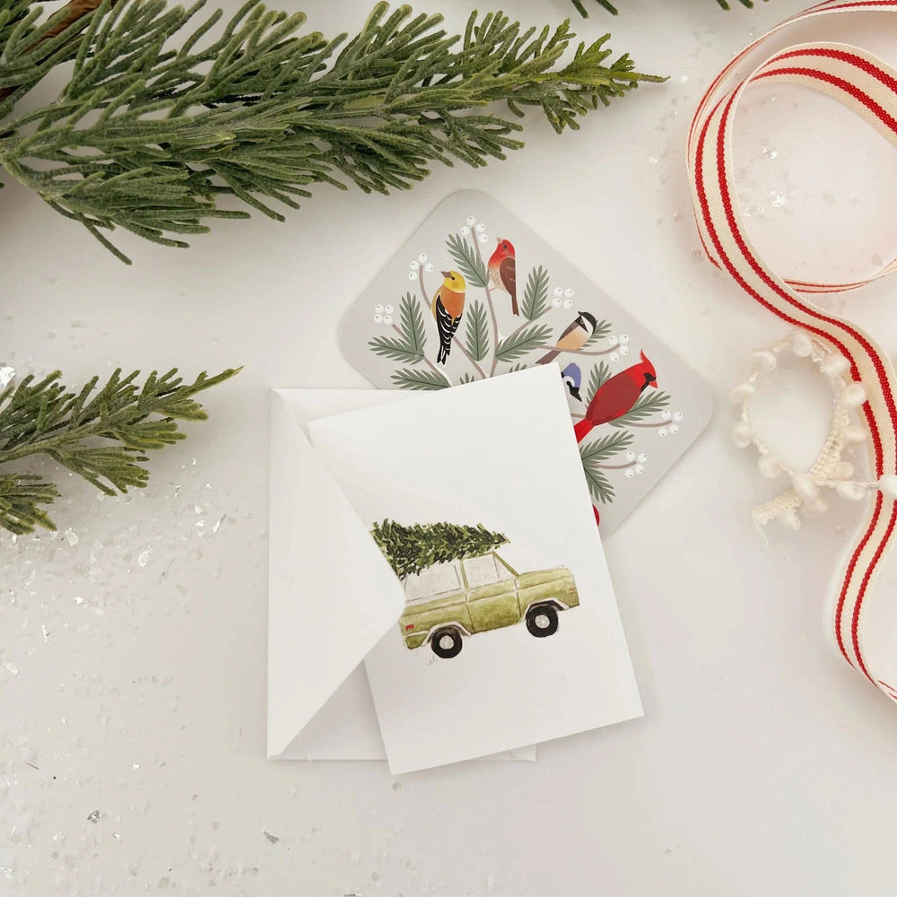 Watercolor Christmas tree truck mini enclosure notecard with a vintage truck illustration and bird-themed envelope liner.