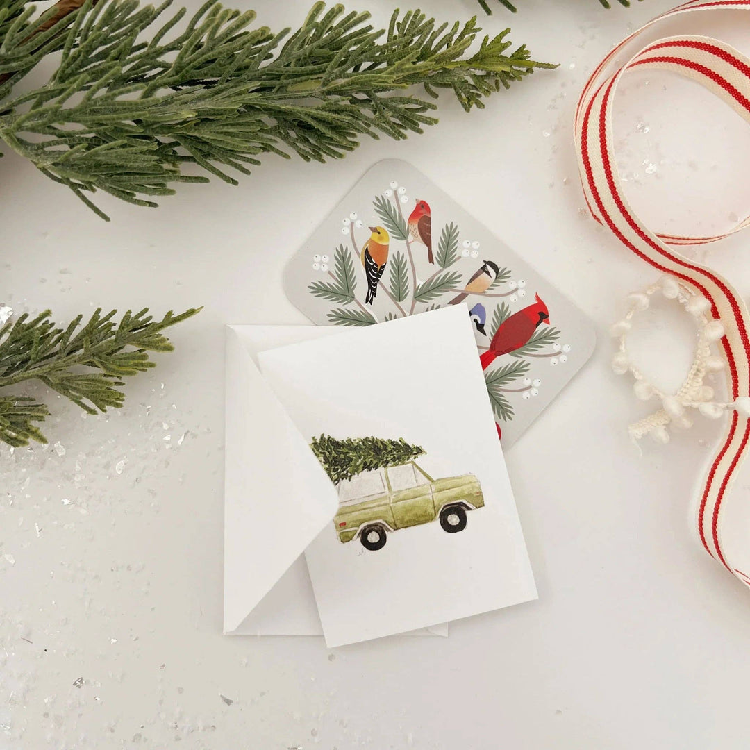 Watercolor Christmas tree truck mini enclosure notecard with a vintage truck illustration and bird-themed envelope liner.