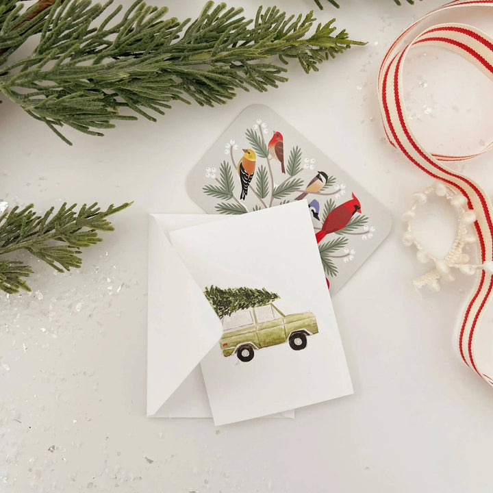 Watercolor Christmas tree truck mini enclosure notecard with a vintage truck illustration and bird-themed envelope liner.