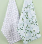 Two dishtowels: one with light purple geometric diamonds, one with green leafy vines. Hydrangea Garden set, available in 18"x28".
