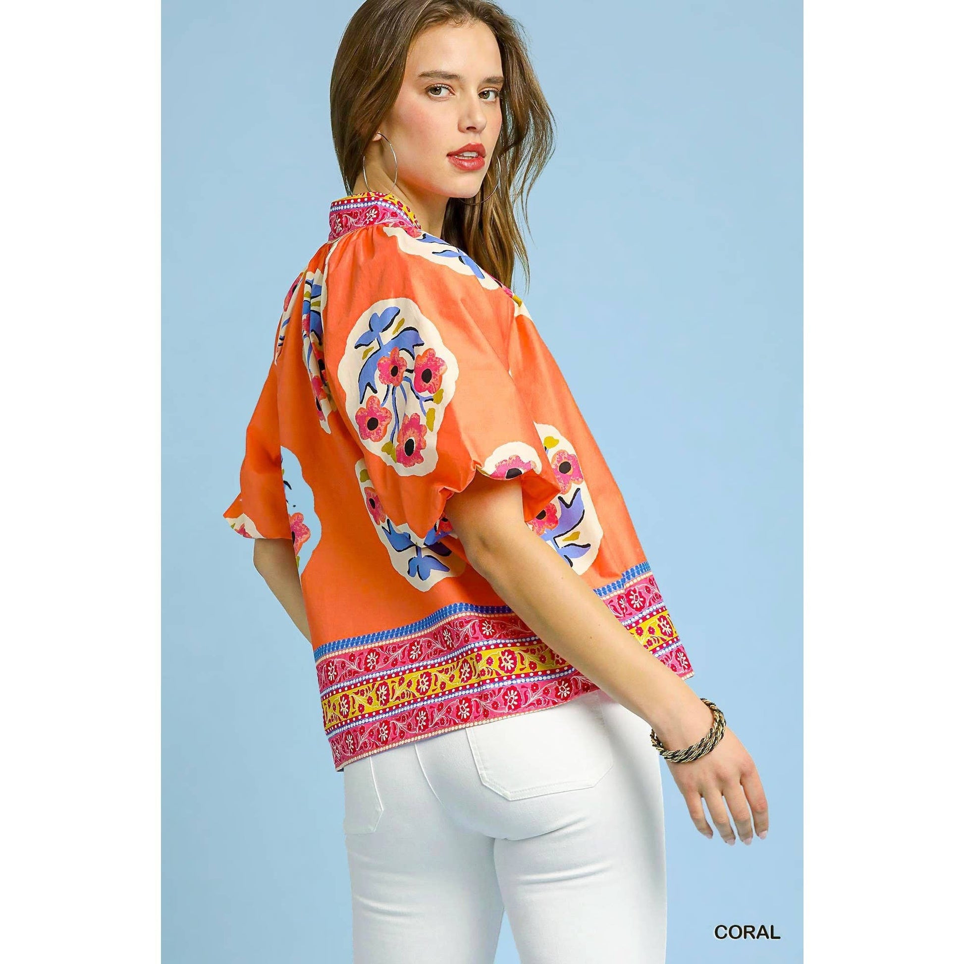 Sunset Floral Embroidery Top with colorful florals, wide sleeves, patterned hem. Available in XS-XL.