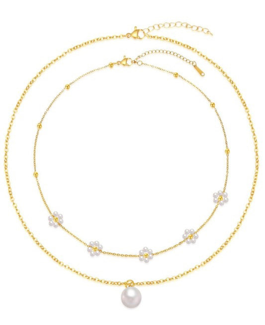 18K non-tarnish stainless steel chain necklace set with gold chain, white beaded flowers, and pearl pendant. Sizes: S, M, L.