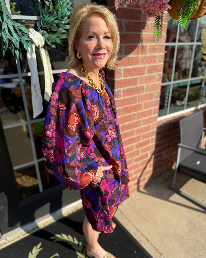 Shirred Floral Shift Dress with a floral pattern and shirred detailing. Available in sizes XS-XL.