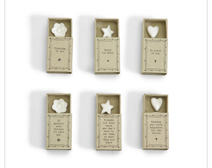 Six Sweet Wishes Matchbox UN boxes with white porcelain flower, star, or heart; includes note. Sizes vary.