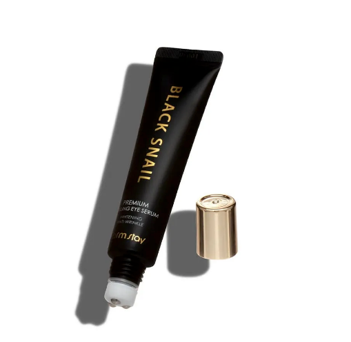Sleek black tube with gold text, white applicator tip, and gold cap; FARMSTAY Black Snail Eye Serum. Available in 25ml.