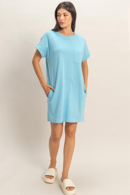 Relaxed Fit Crewneck T-Shirt Dress in light blue with short sleeves, chest pocket, and side pockets. Sizes XS-XL.