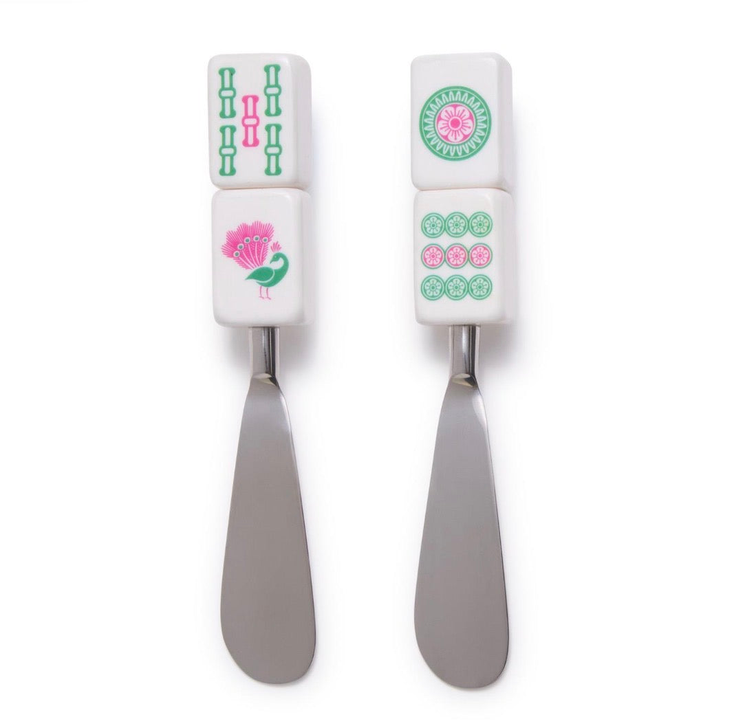 Two metal Mahjong tile-handled spreaders featuring bamboo, peacock, and floral designs.