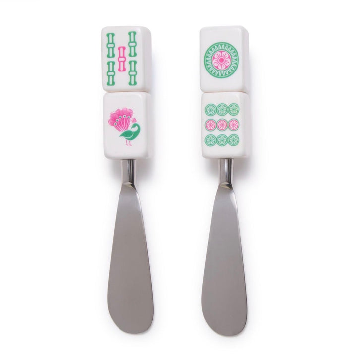Two metal Mahjong tile-handled spreaders featuring bamboo, peacock, and floral designs.